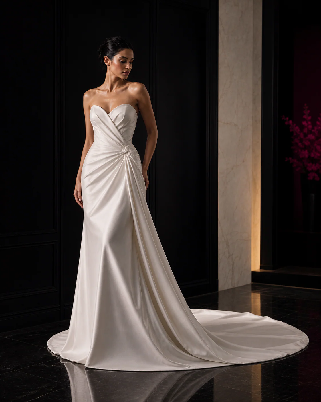 Editorial portrait of a woman in an original sculpted ivory bridal gown